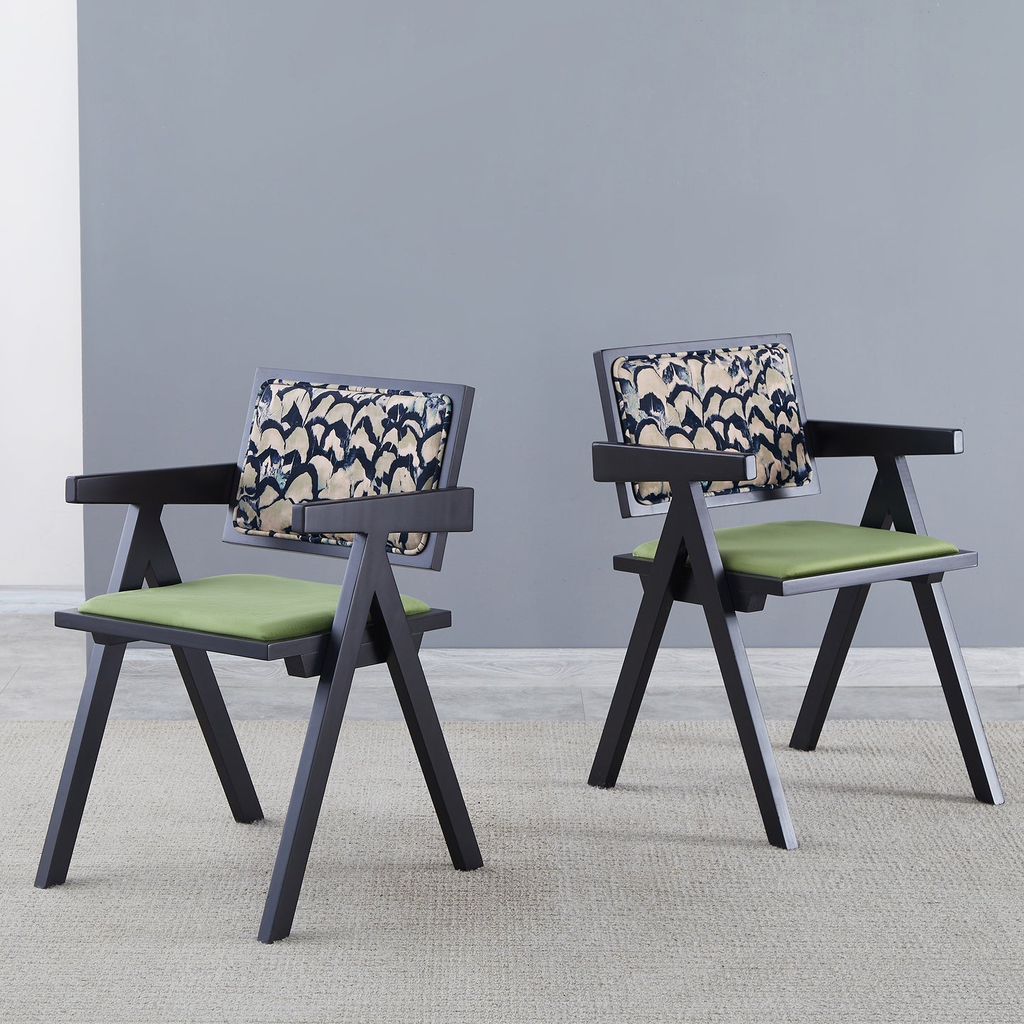 Modern accent chair with black frame and patterned back cushion
