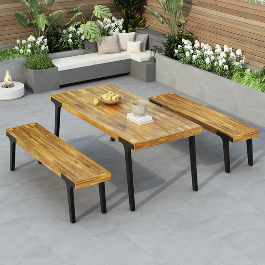 Acacia wood dining table with black metal legs and two matching benches
