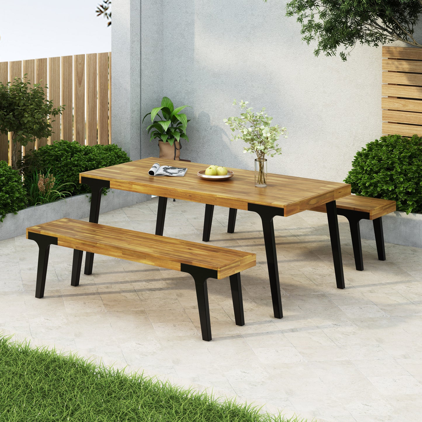 Acacia wood patio dining table with black metal legs and matching benches