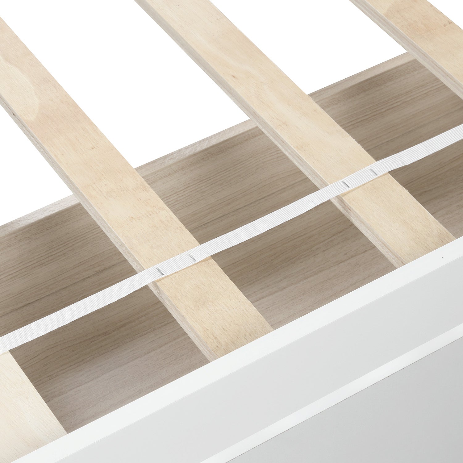 White bed frame detail showing wooden slats and integrated storage