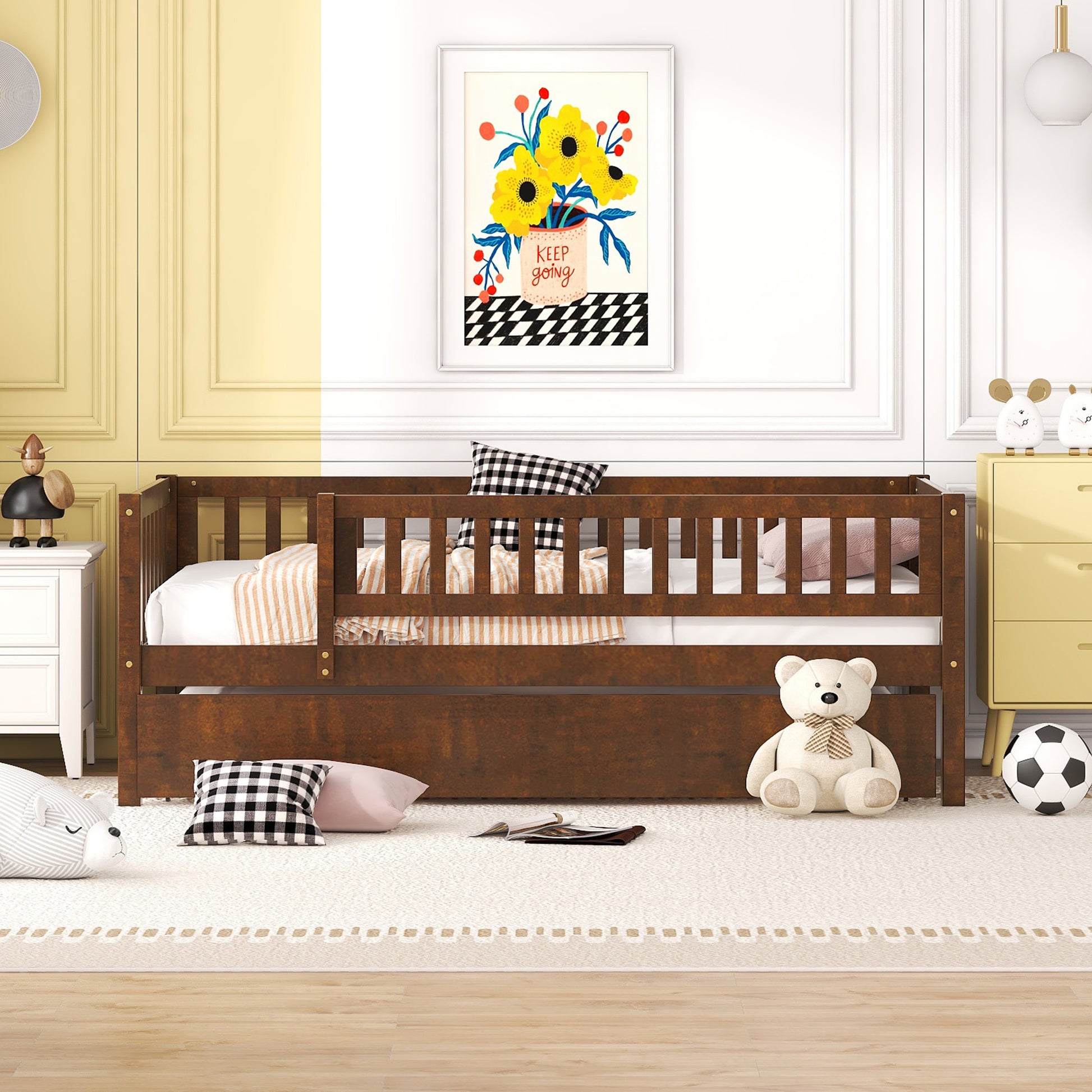Dark wood toddler bed with pullout trundle and white bedding
