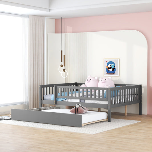 Gray wooden daybed with trundle featuring a slatted design for versatile child or guest sleeping