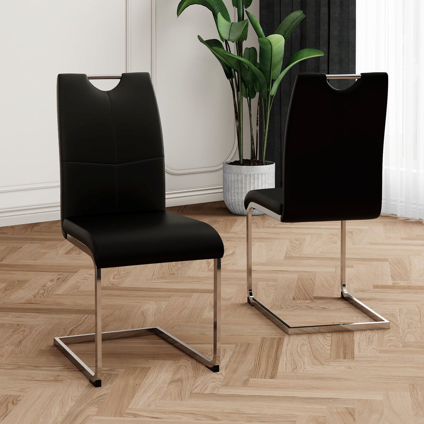 Black faux leather dining chair with chrome sled base