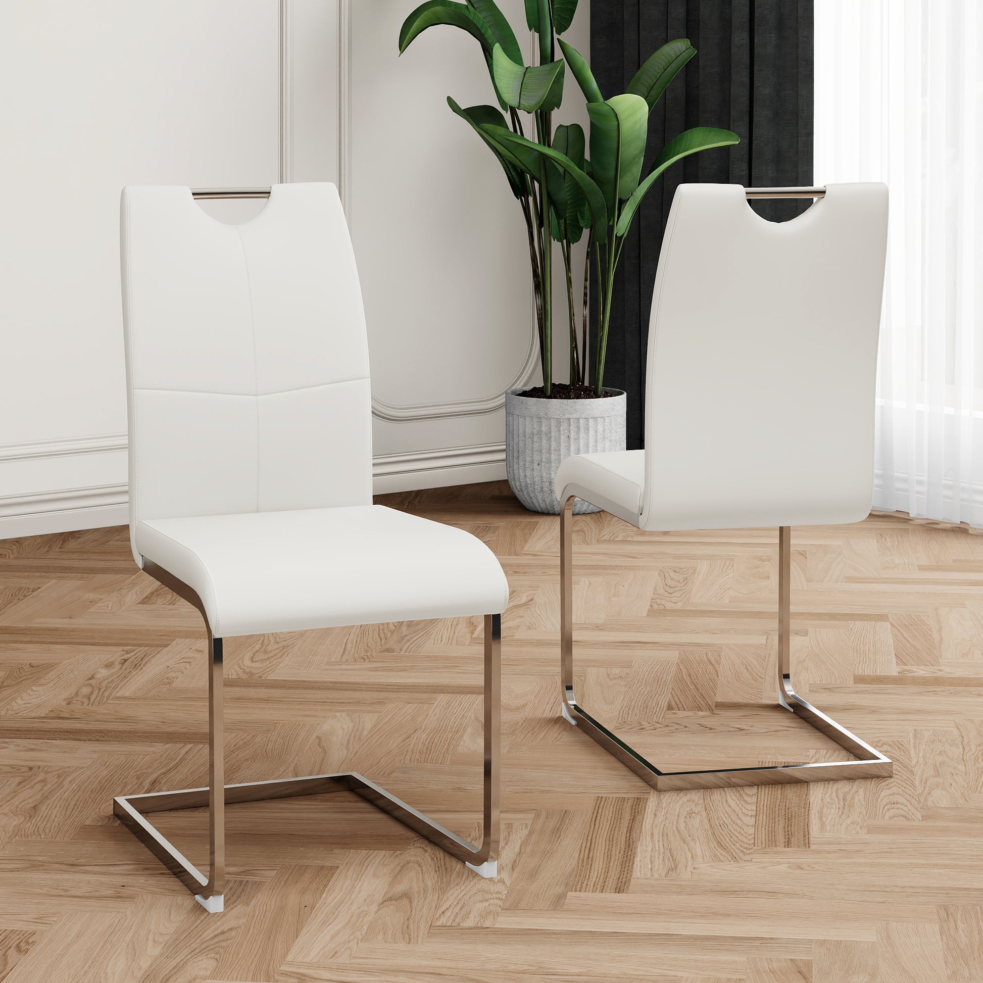 White faux leather cantilever chair with chrome legs and a modern cutout handle