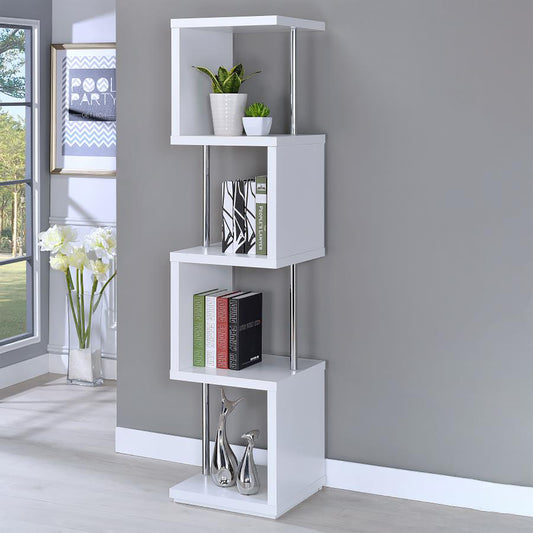 White modern zigzag bookshelf with chrome accents holding books and decor