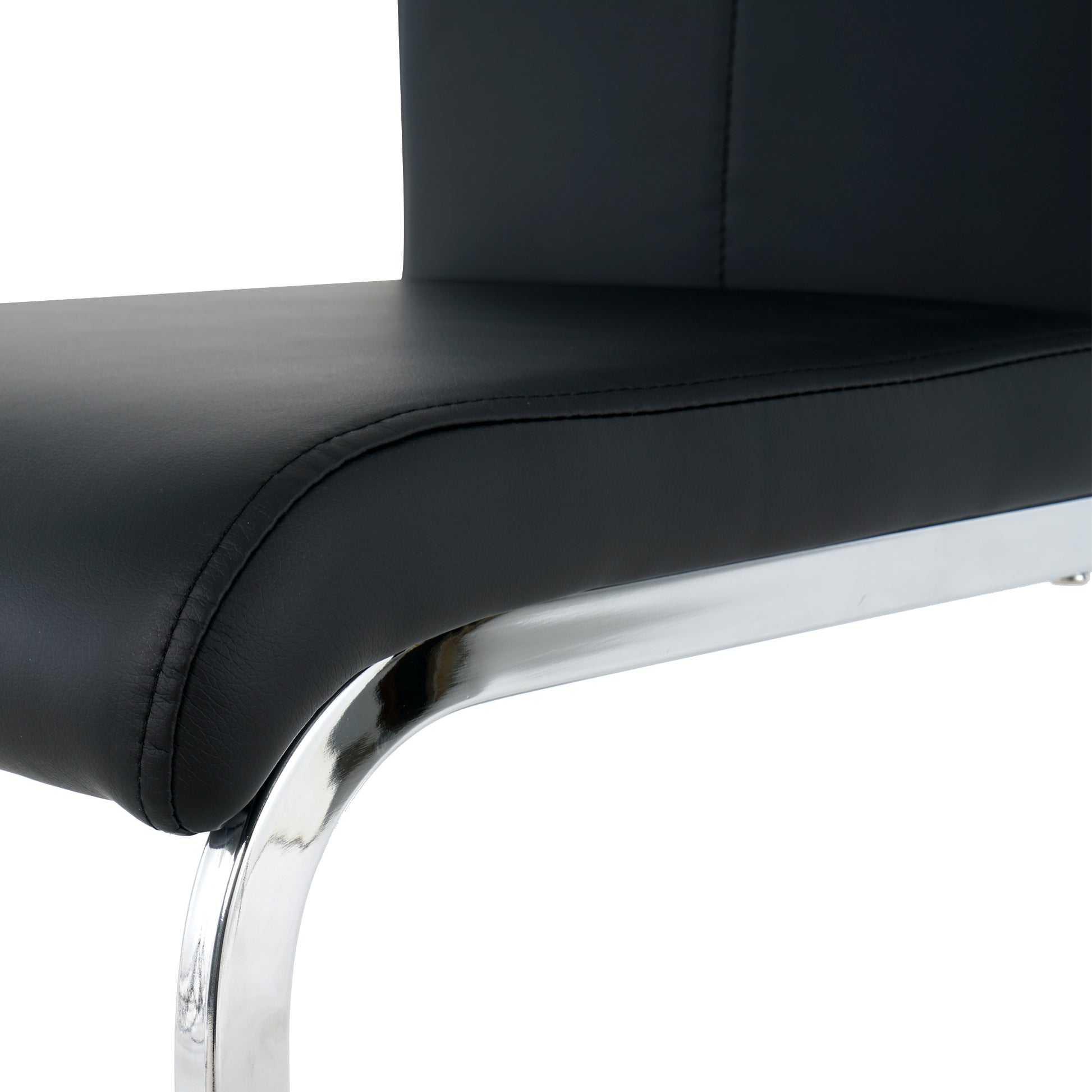 Black faux leather dining chair seat detail with chrome base