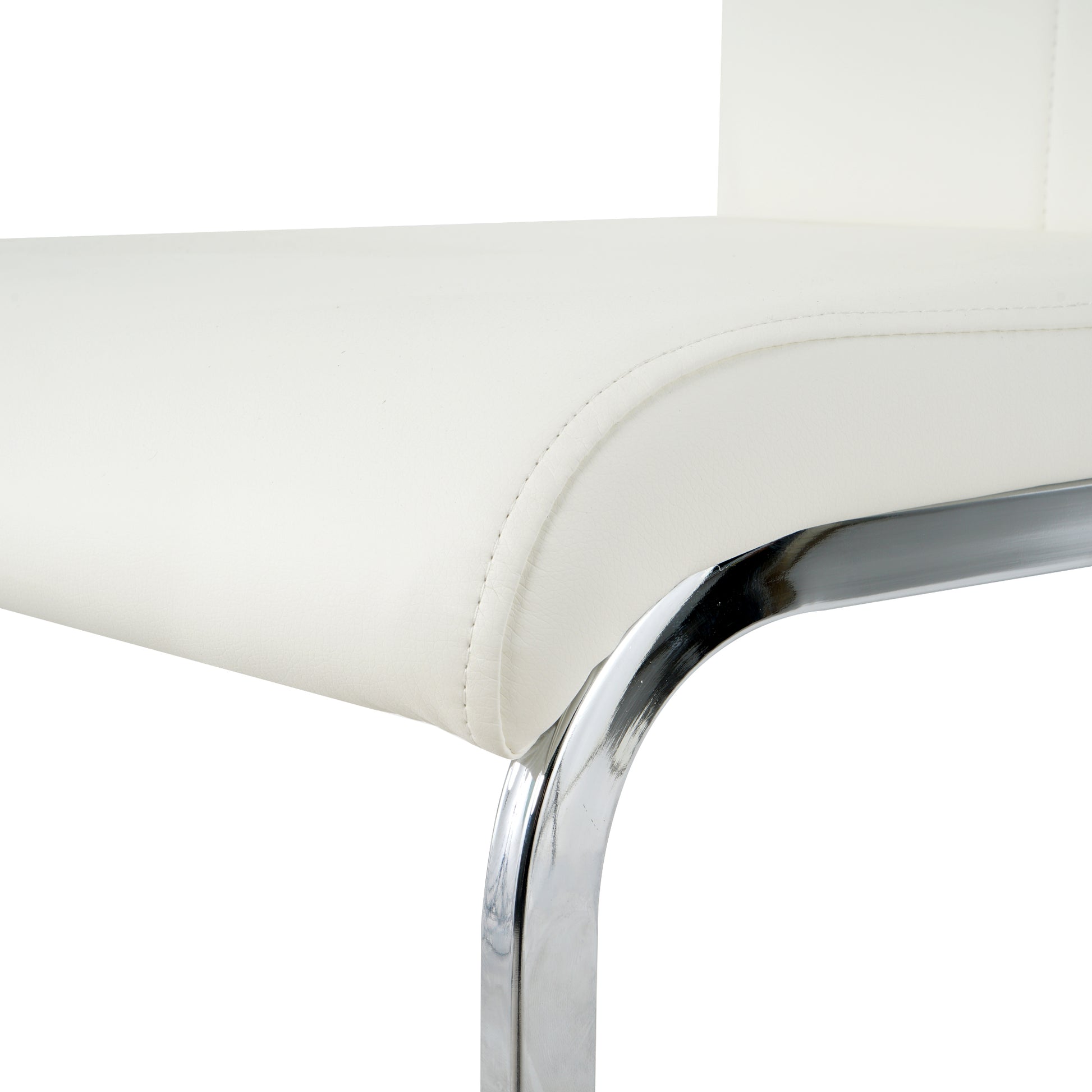 Closeup of a white faux leather chair seat with chrome legs