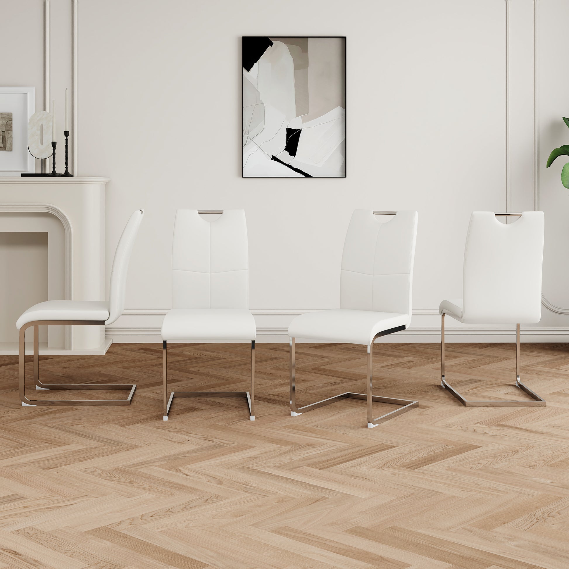 Set of four white faux leather dining chairs with chrome legs