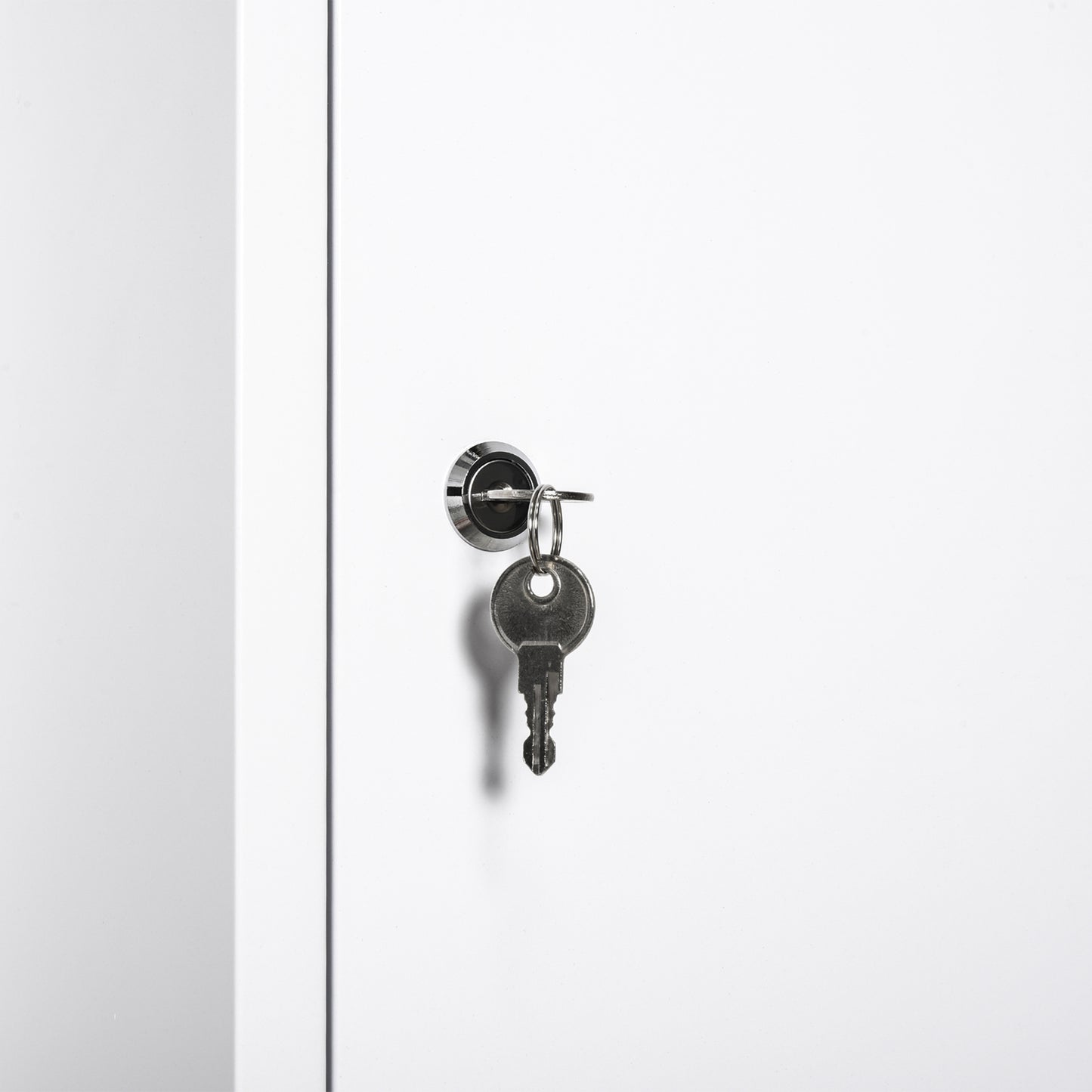 Single silver key in a lock