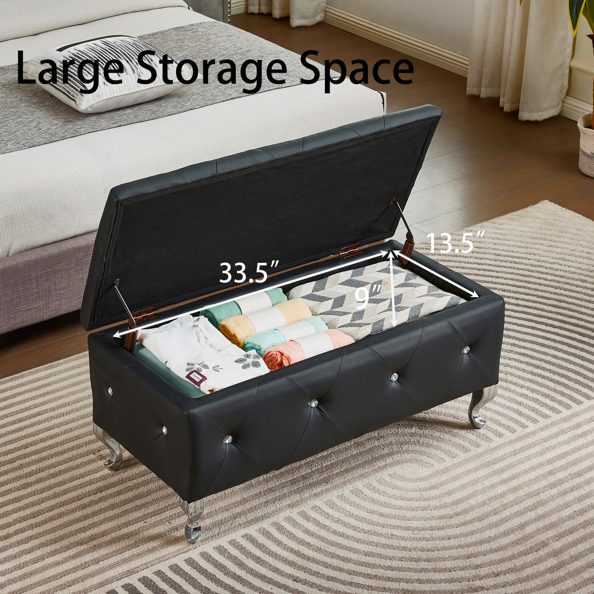 tufted black faux leather storage ottoman with crystal accents and silver legs