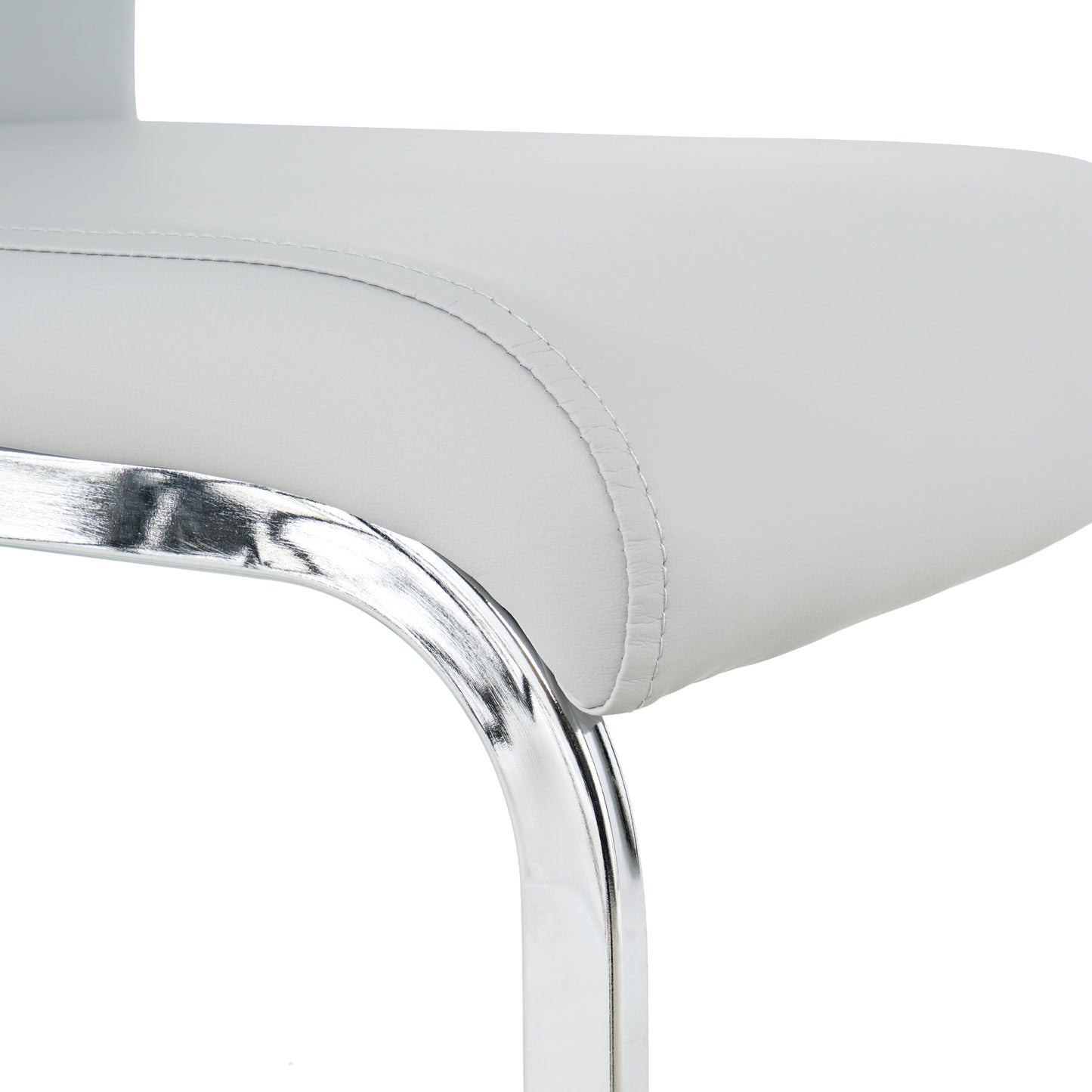 Closeup of white faux leather seat cushion with detailed stitching and chrome leg