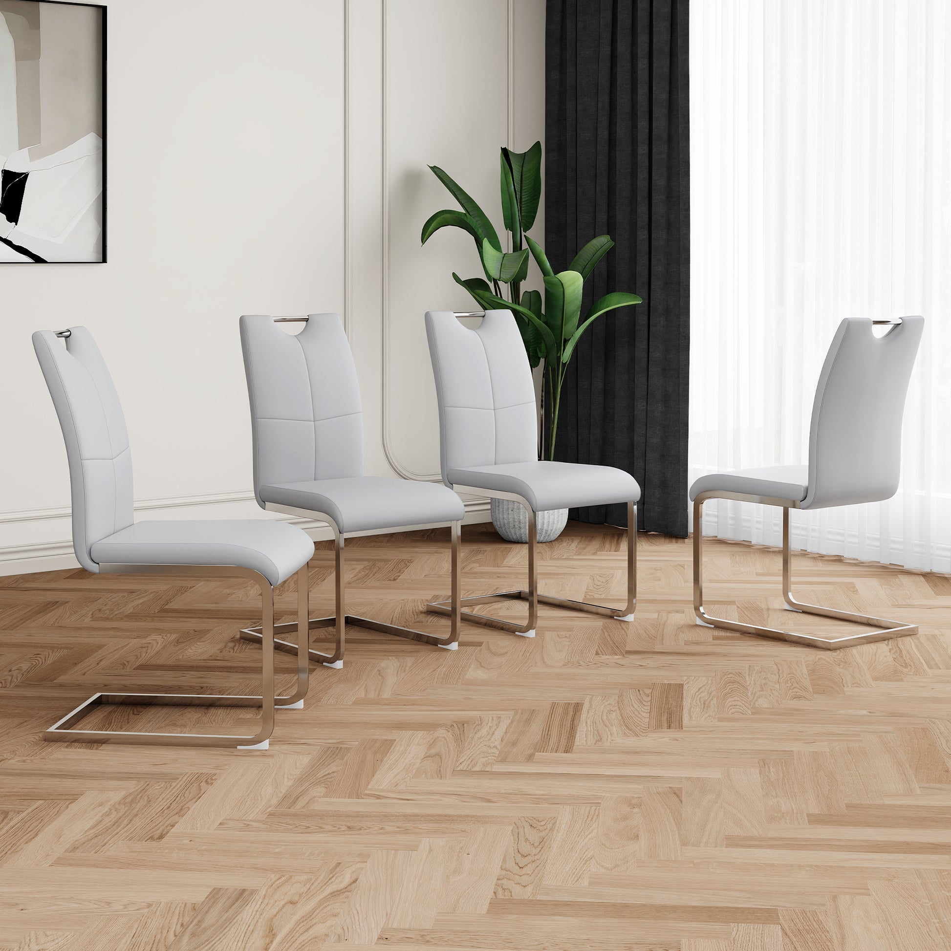 Light grey leather dining chairs with chrome sled legs