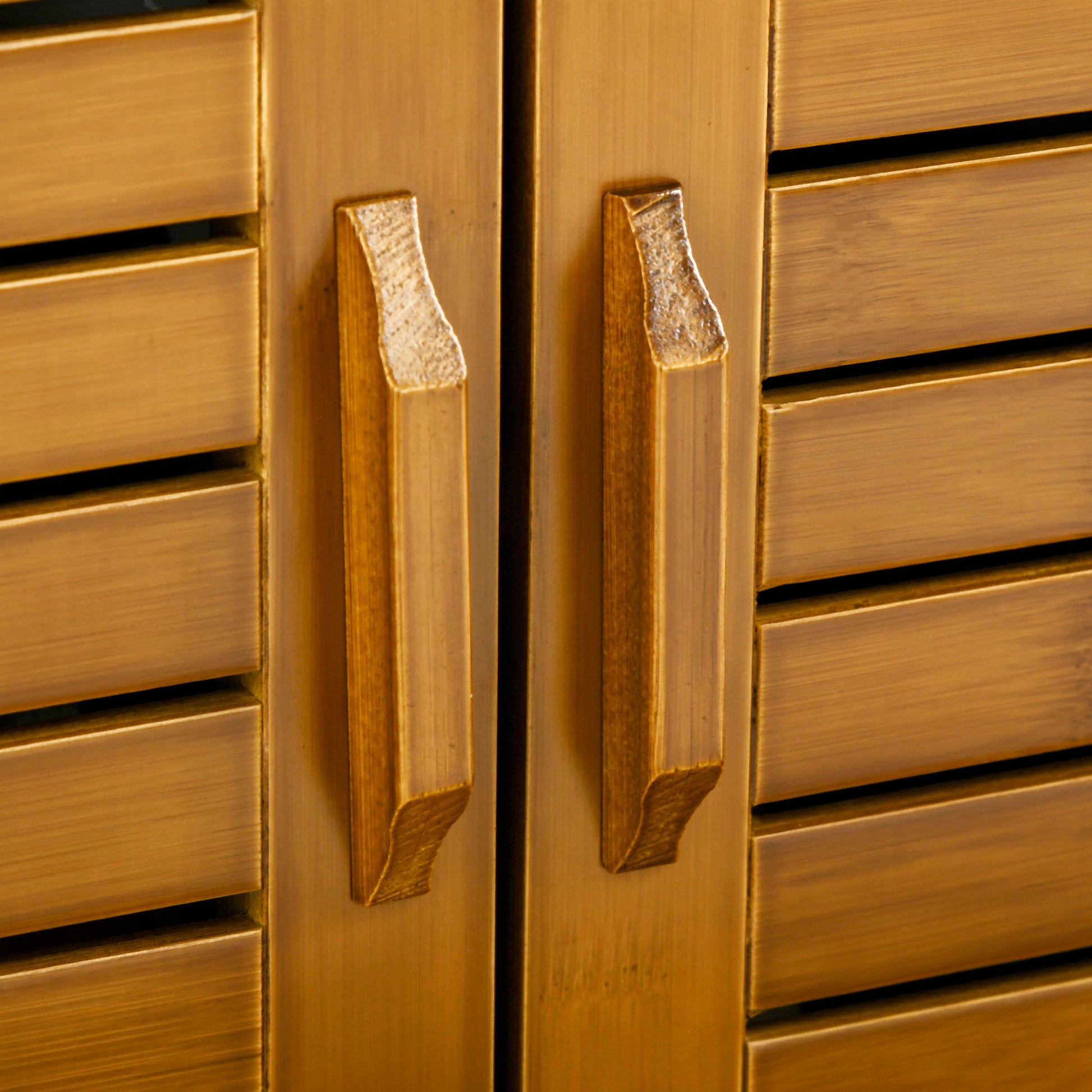 Modern brass cabinet handles on slatted doors