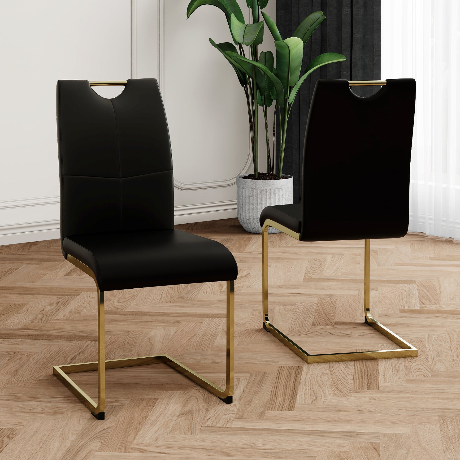 Black faux leather dining chair with gold metal sled base