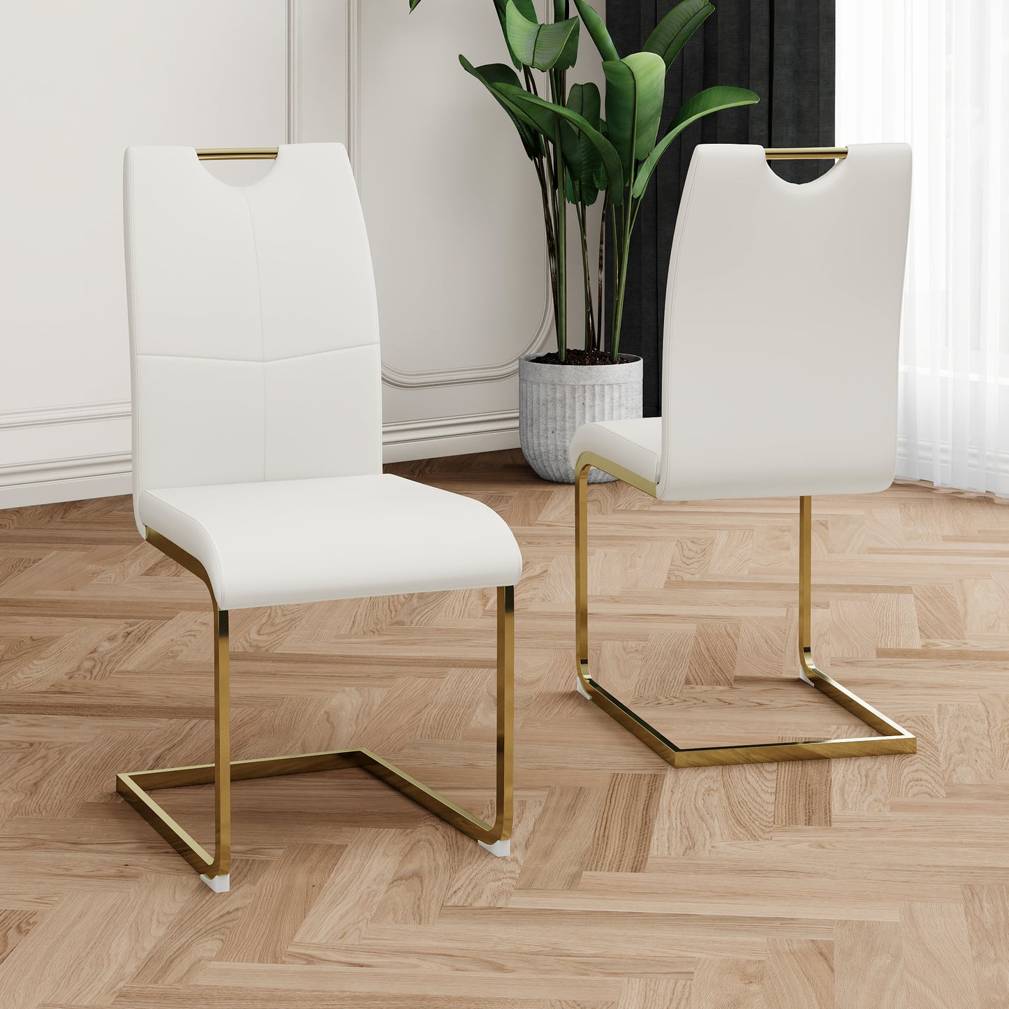 White faux leather dining chair with gold sled legs and cutout handle