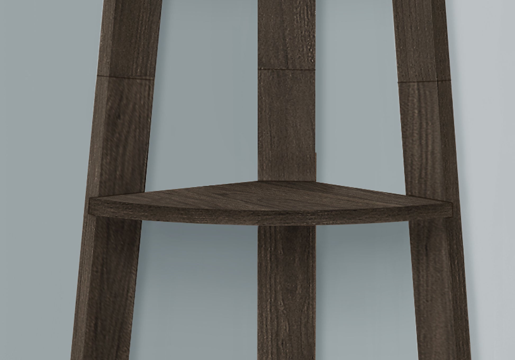 Dark wood corner shelf unit with tiered shelves