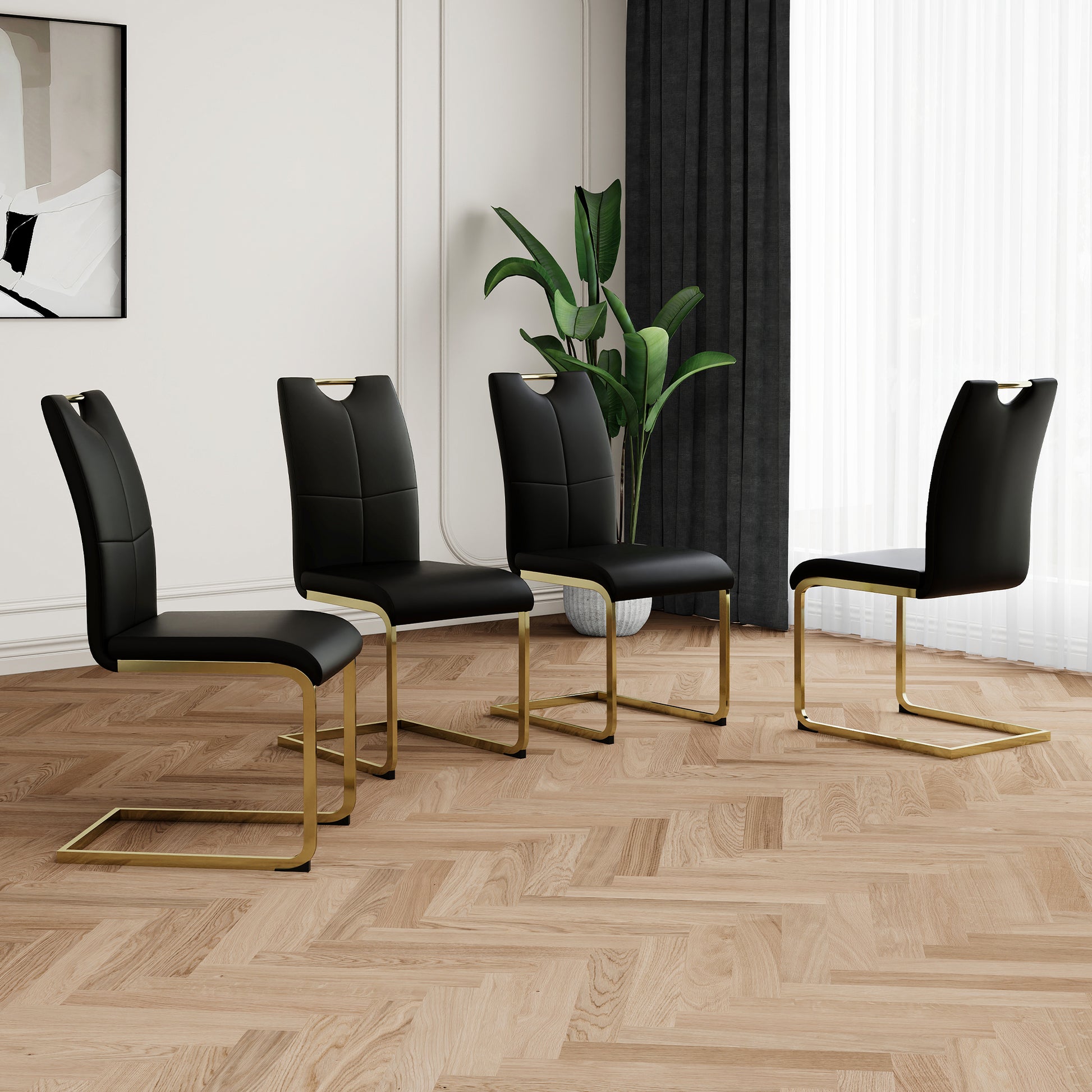 Black faux leather dining chairs with gold Ushaped legs