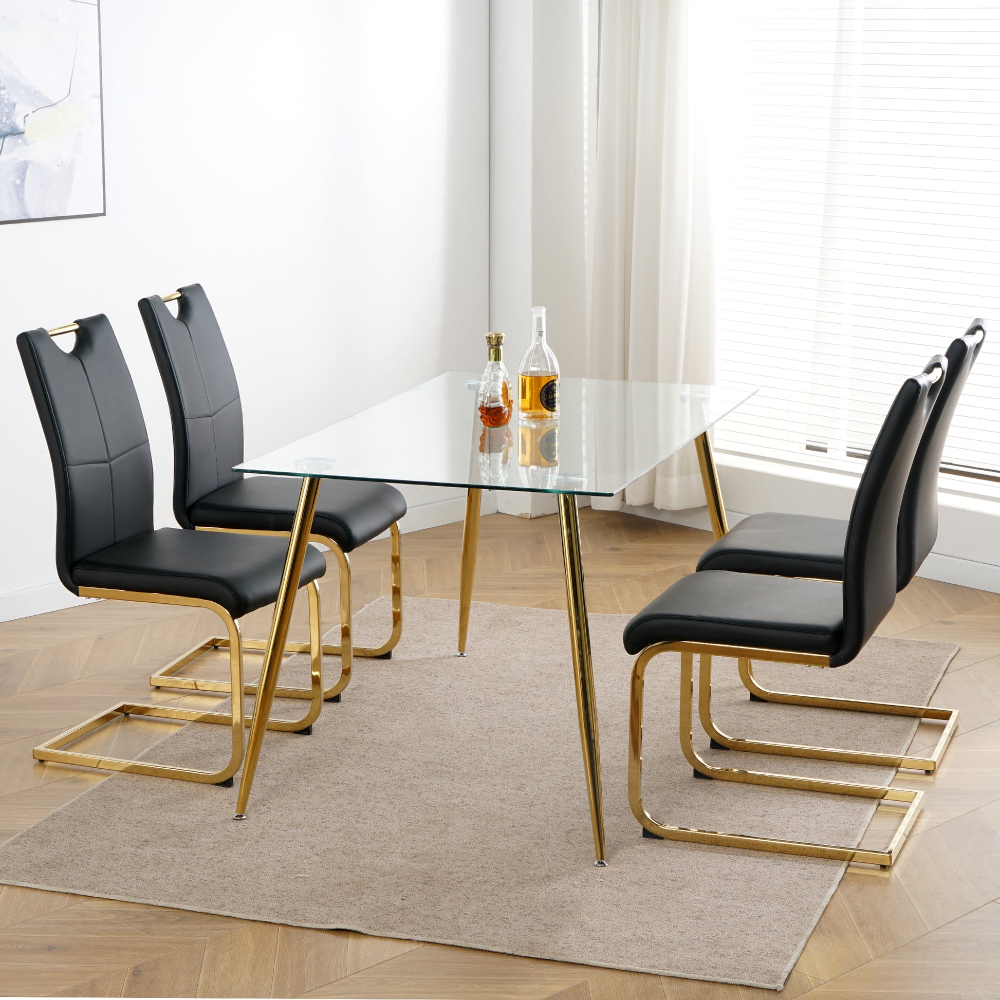 Modern black faux leather dining chairs with gold metal legs