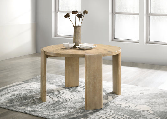 Round wood dining table with natural finish and minimalist design