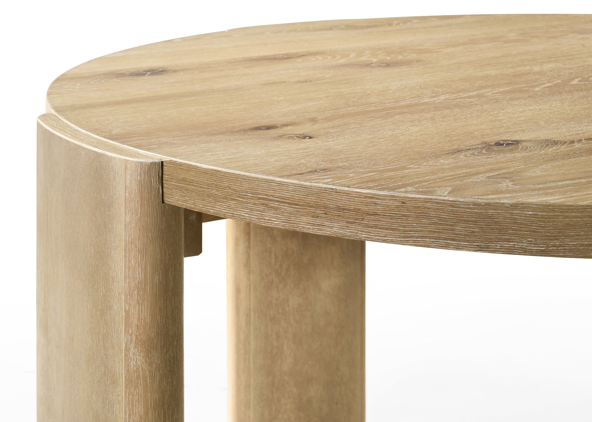 Modern round oak dining table with natural wood grain detail