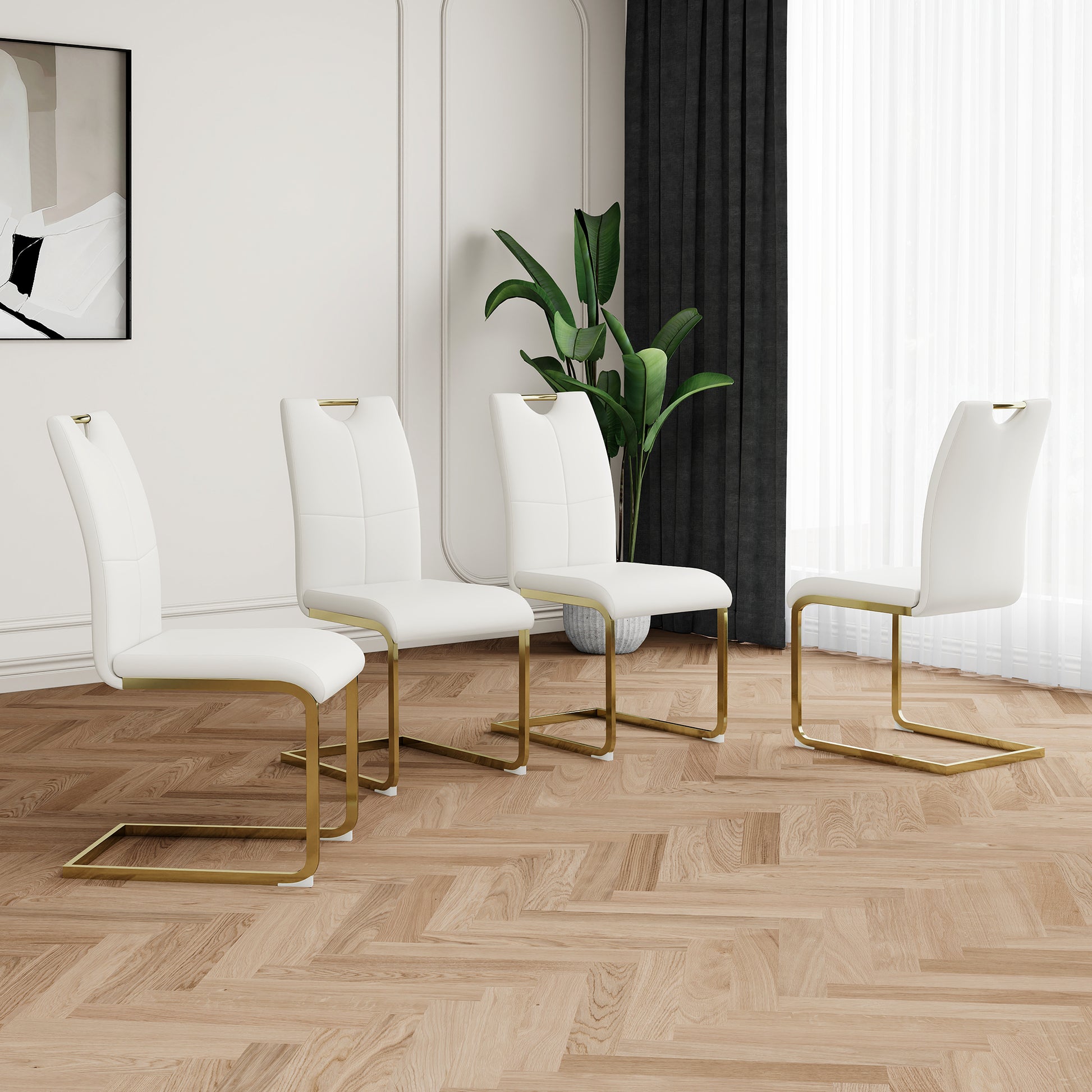Four white leather dining chairs with gold metal frames
