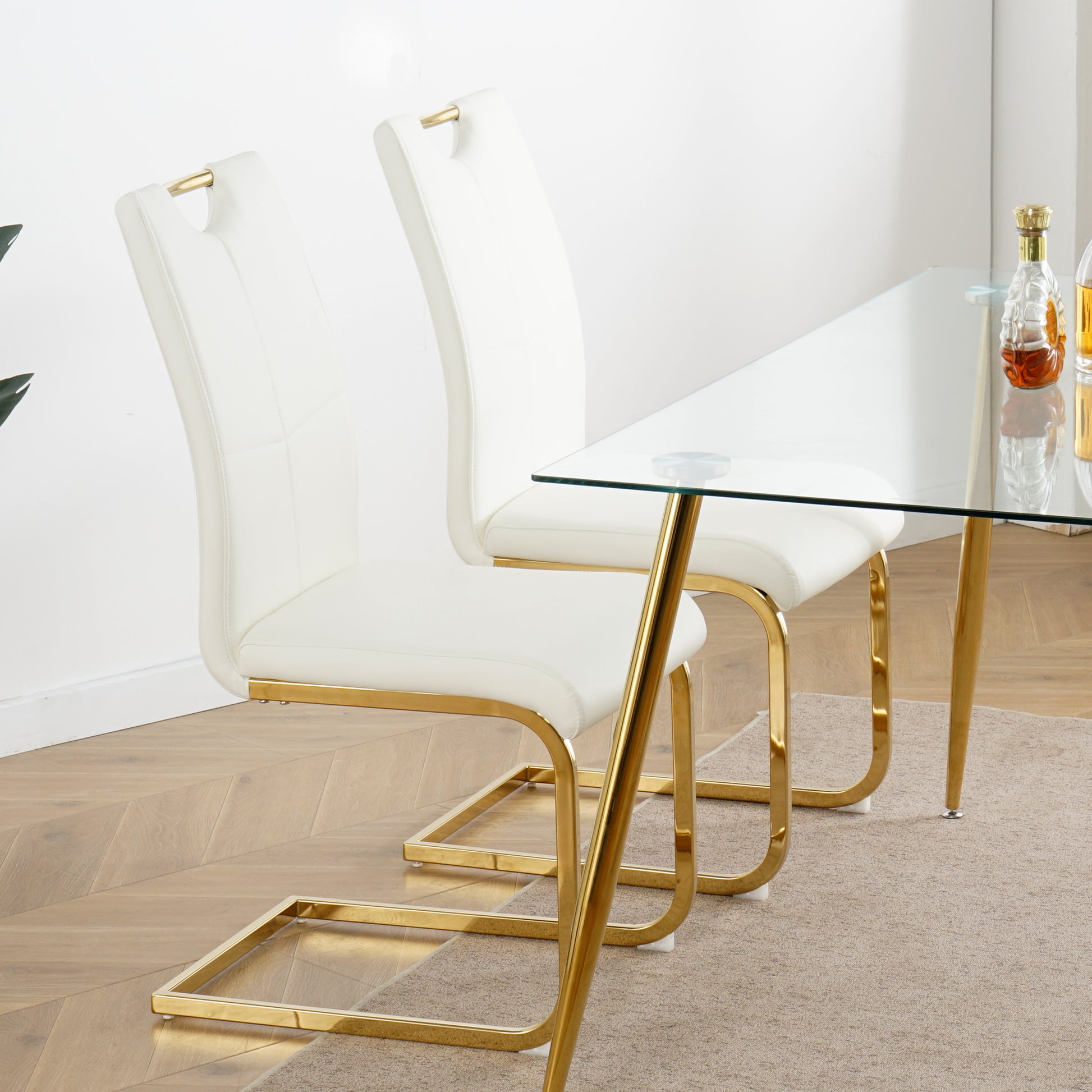 Modern white faux leather dining chair with gold metal frame