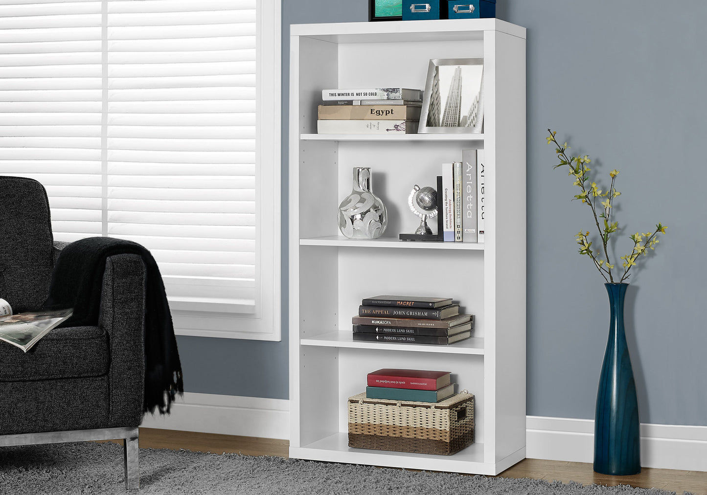 White modern fourshelf bookcase with books and decor