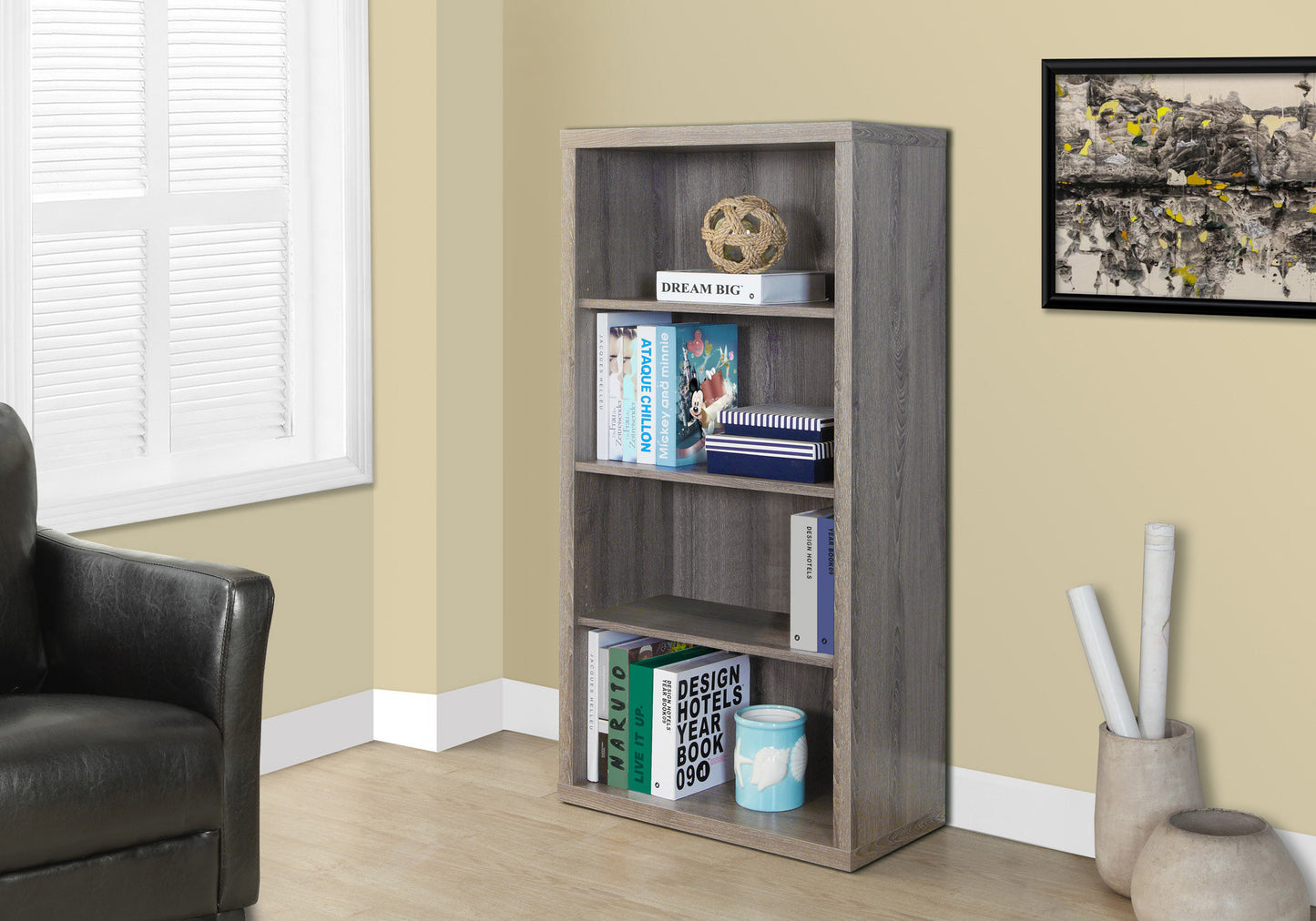 Gray woodgrain bookshelf with four shelves holding books and decor