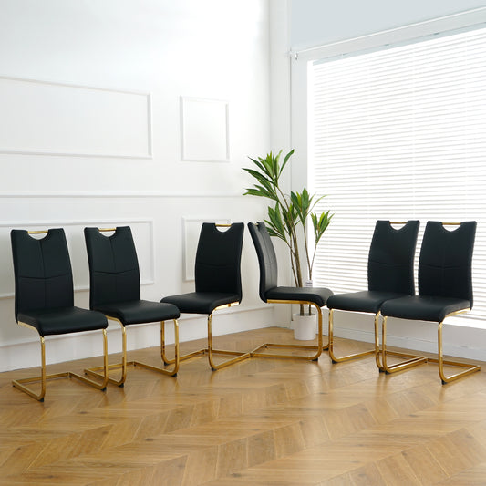 Set of  black faux leather dining chairs with gold metal legs
