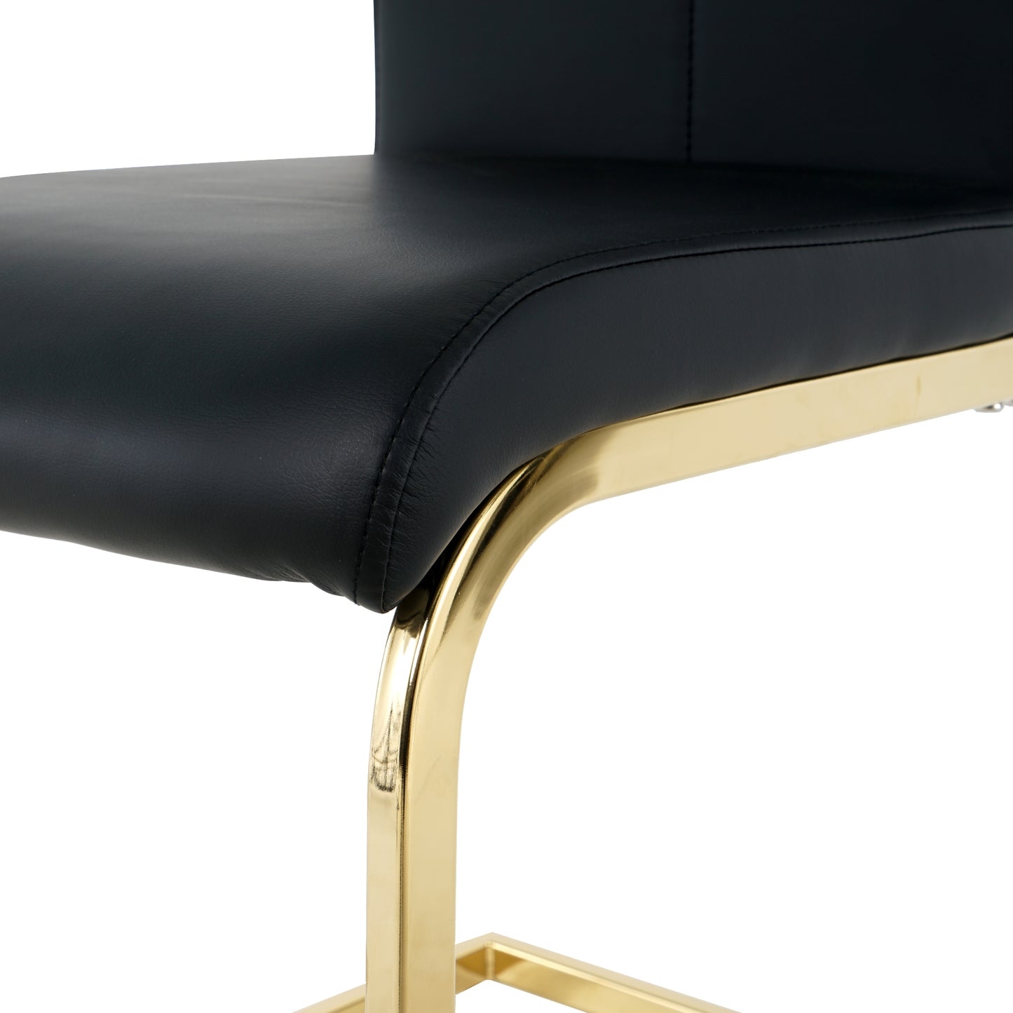Black faux leather accent chair with polished gold legs