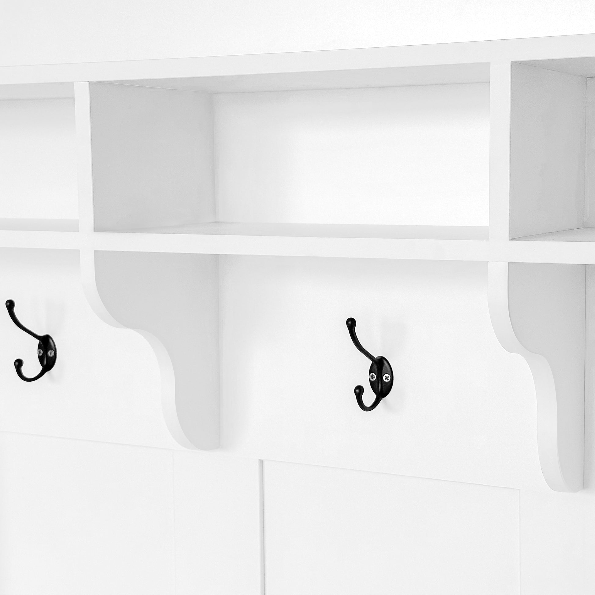 White wooden entryway shelf with black double hooks for coats