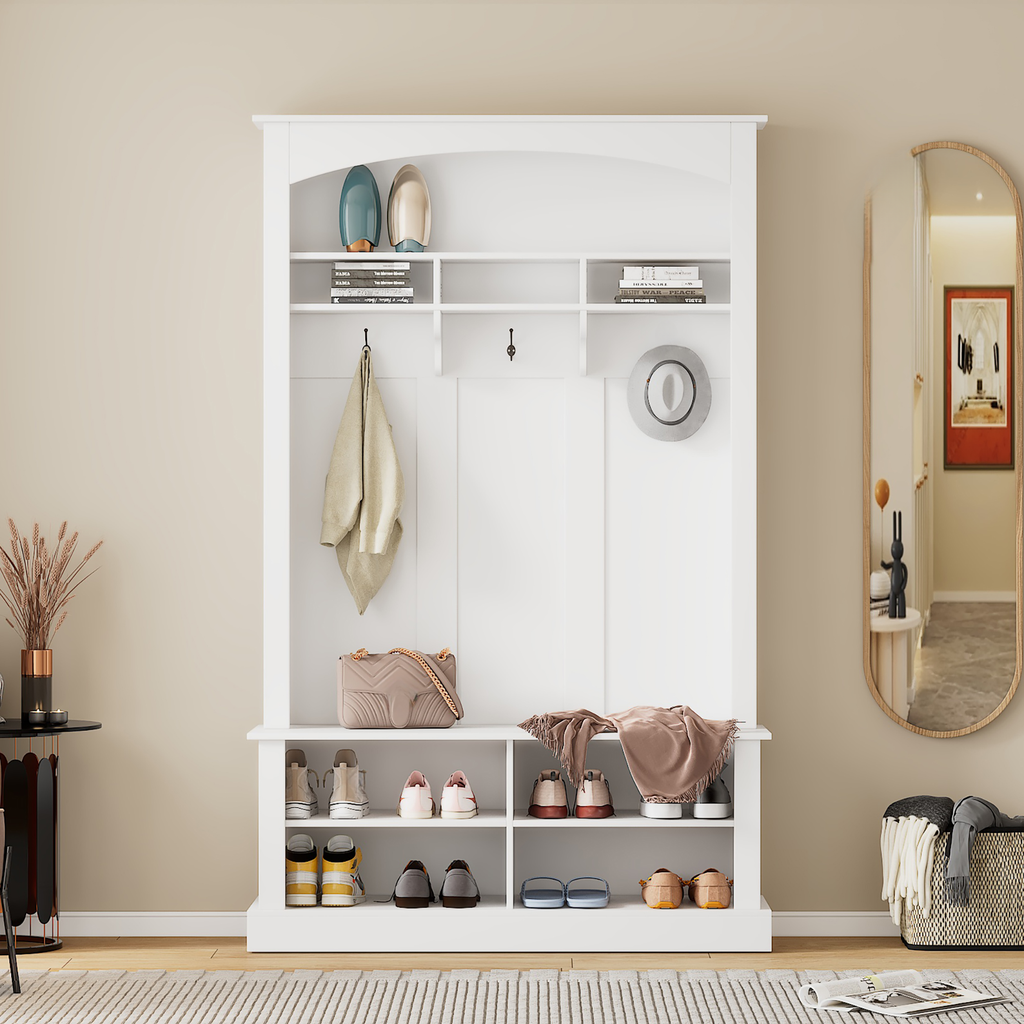 White entryway bench with shoe storage and coat hooks