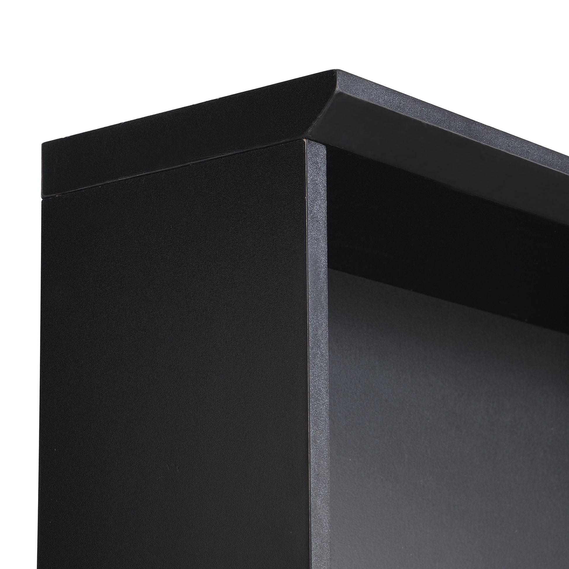 Closeup of black laminate bookshelf corner with textured finish
