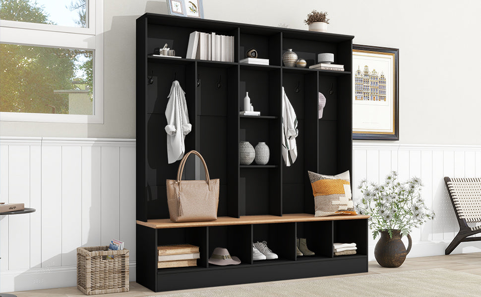 Black entryway organizer with coat hooks and shoe storage cubbies