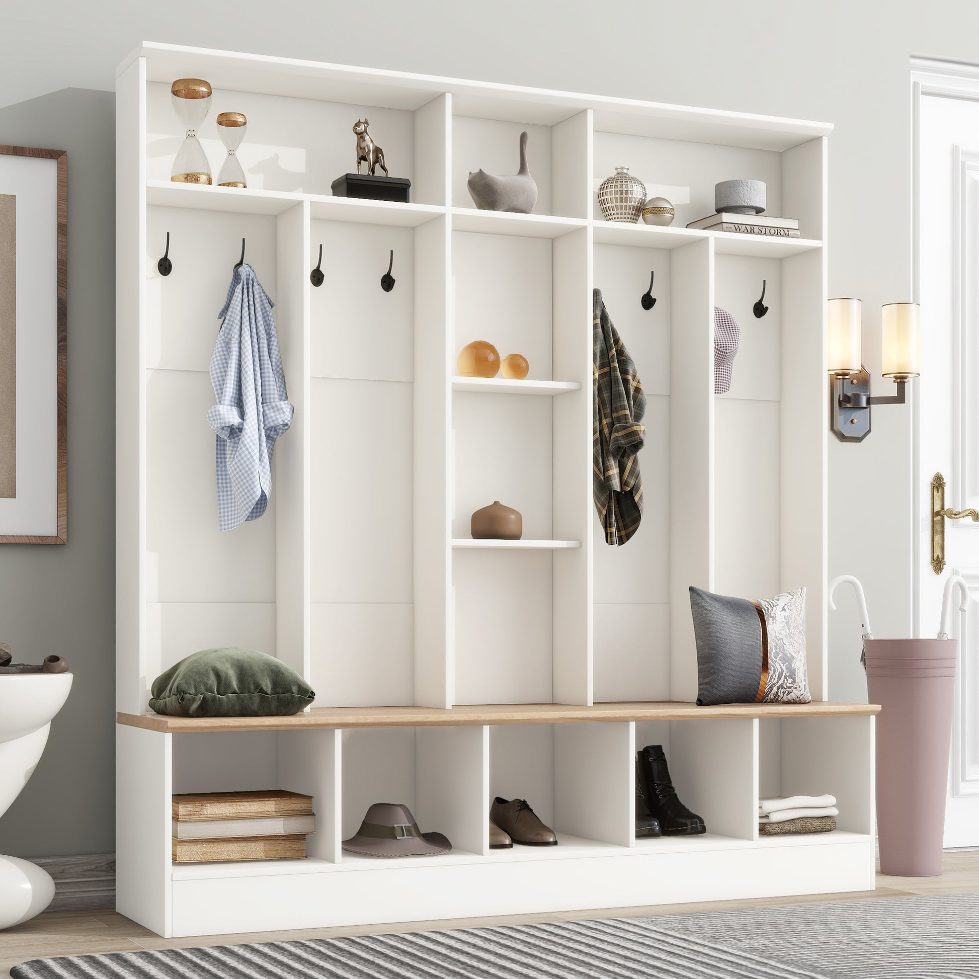 White entryway bench with coat hooks and shoe storage