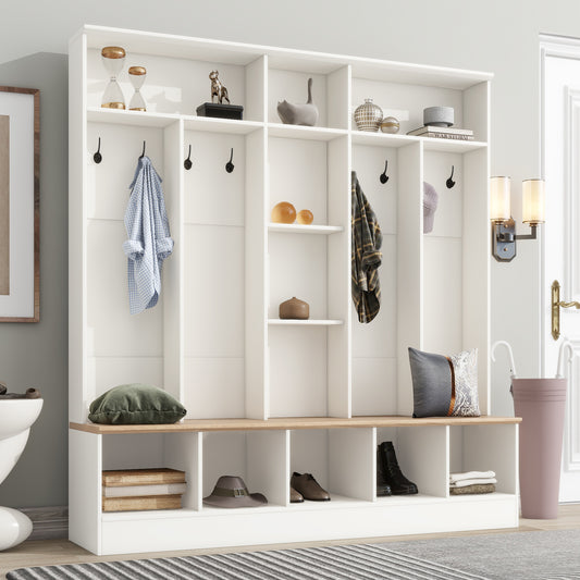 White entryway bench with coat hooks and shoe storage