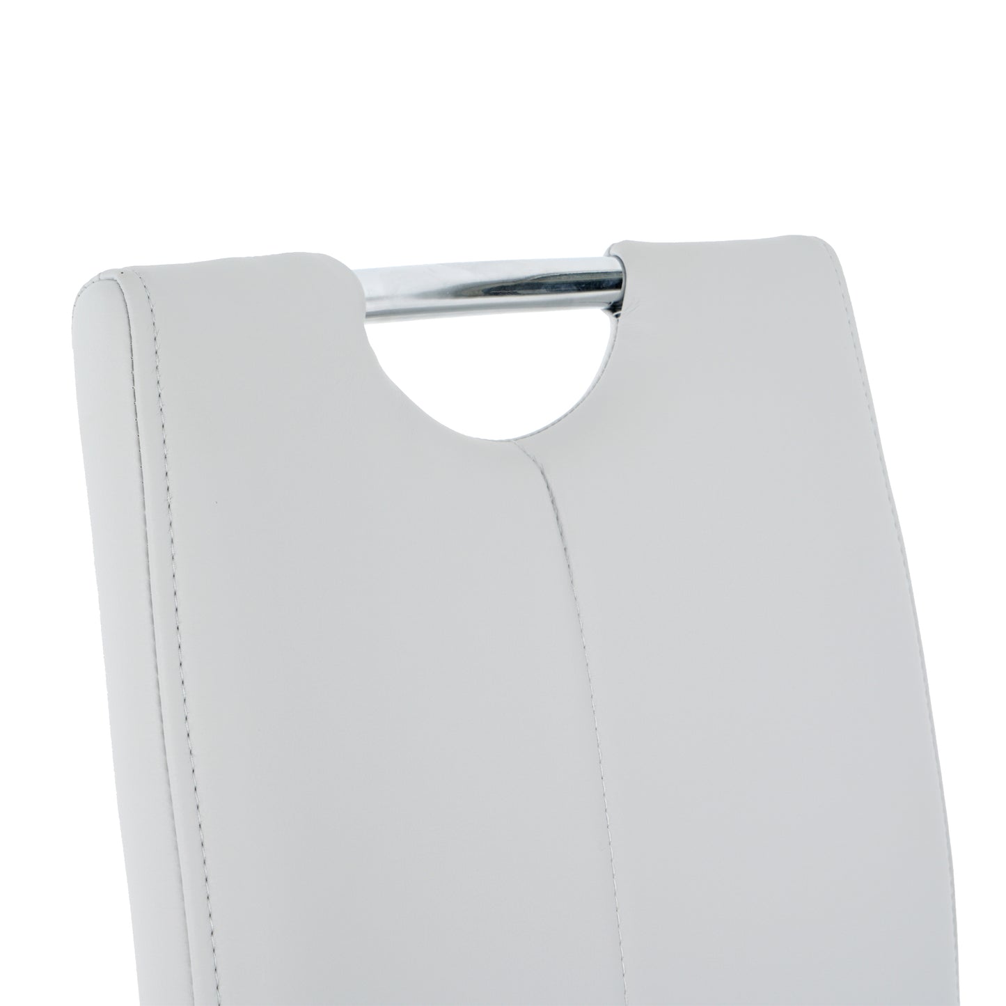 Close up of white faux leather dining chair back with chrome handle