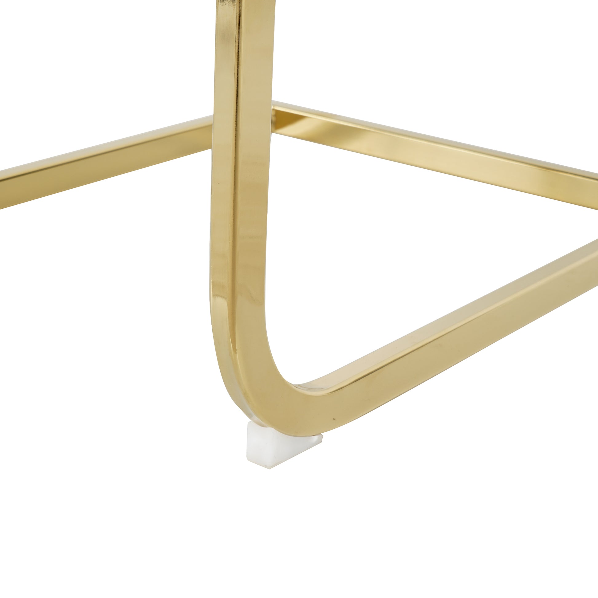 Gleaming gold metal frame detail with white floor protector