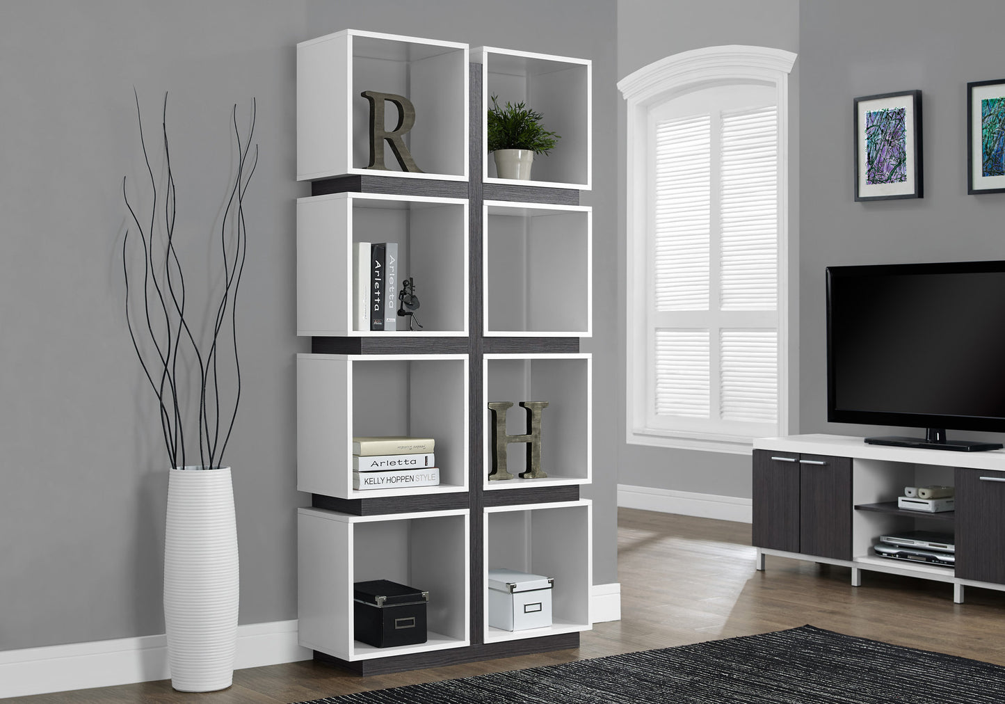 Modern white cube bookshelf with dark wood accents and open shelving