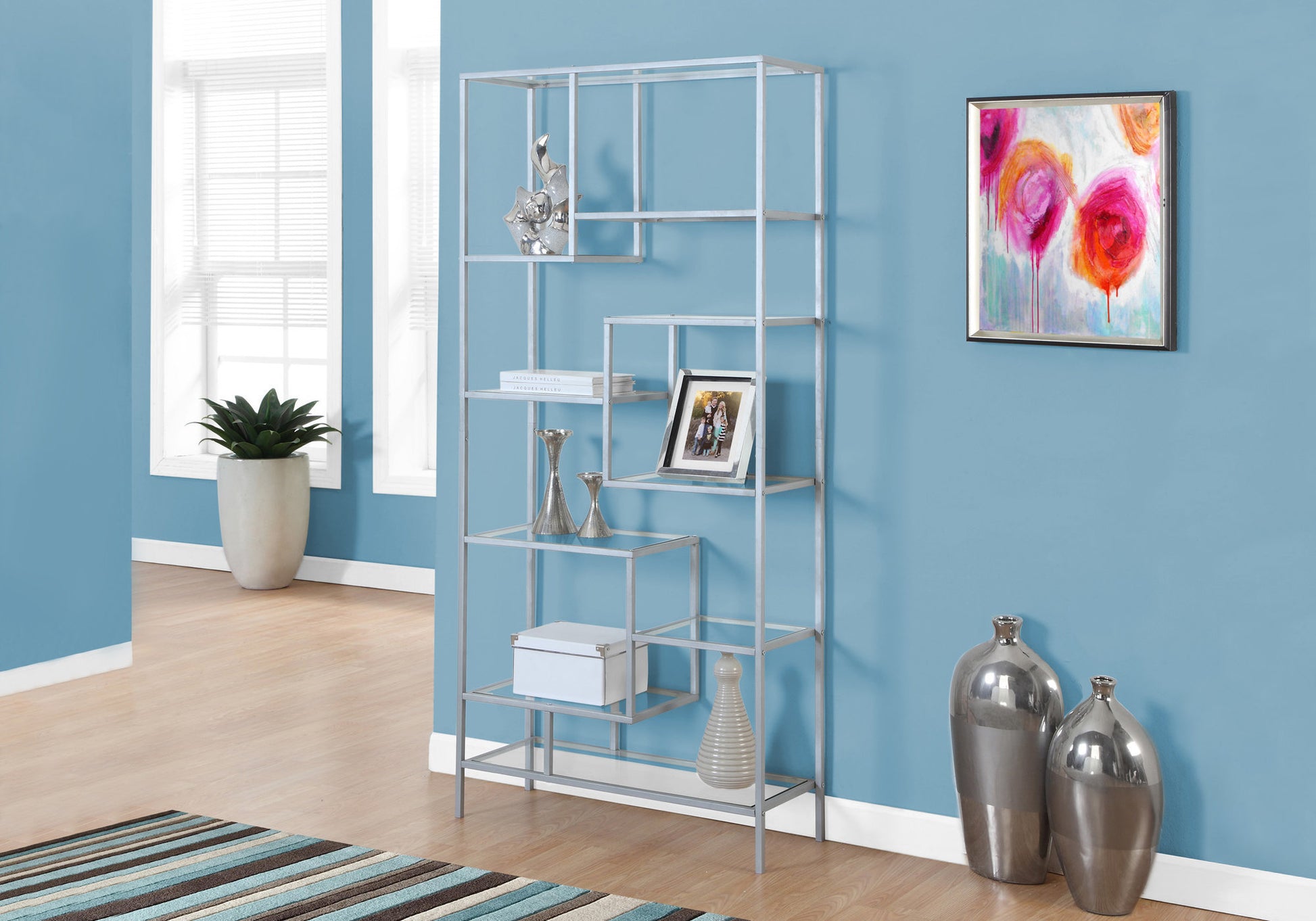 Modern silver metal bookshelf with staggered shelves