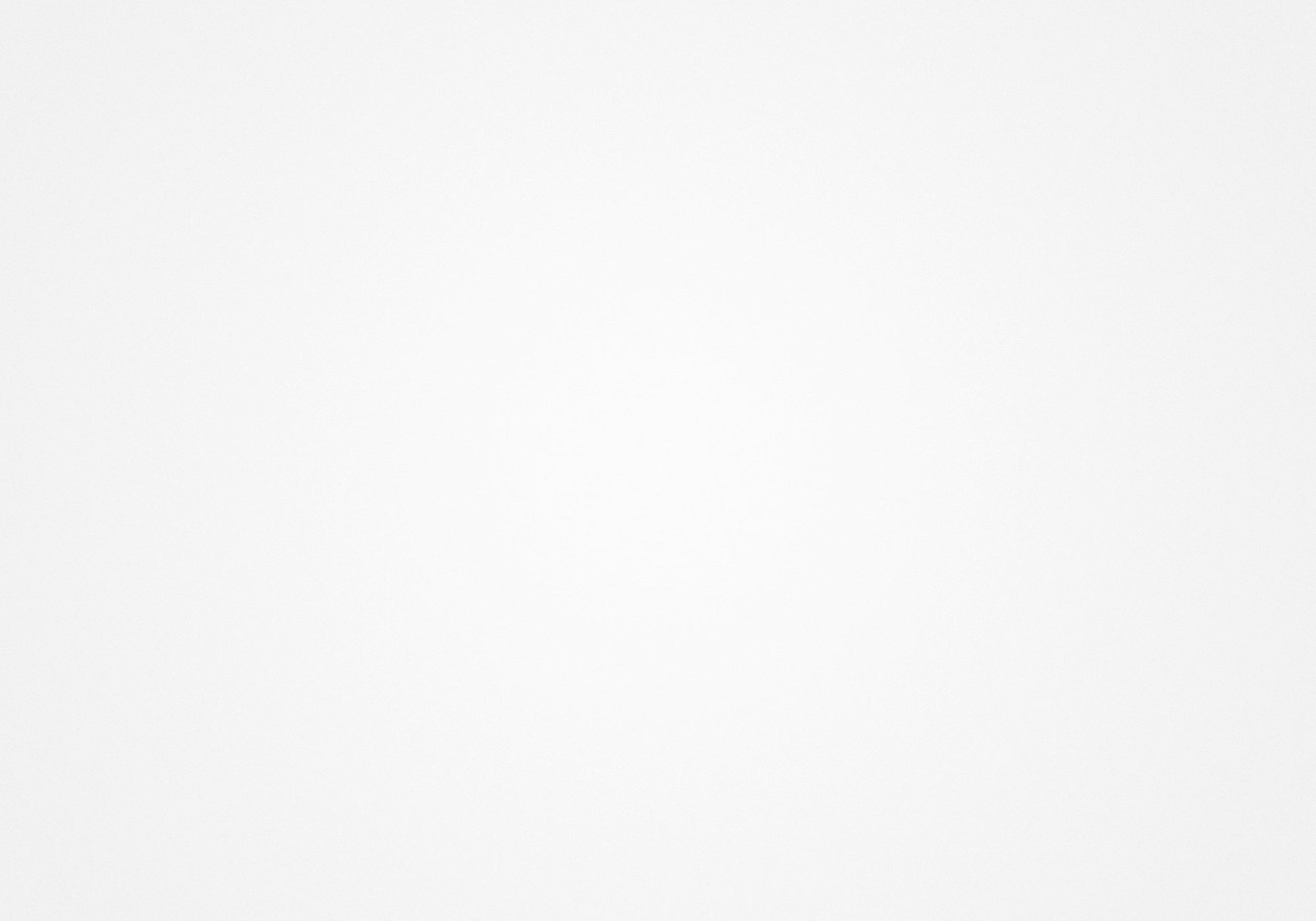 A plain white textured background ideal for product photography