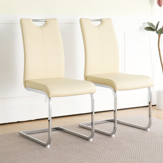 Cream faux leather dining chairs with chrome cantilever bases and curved backs