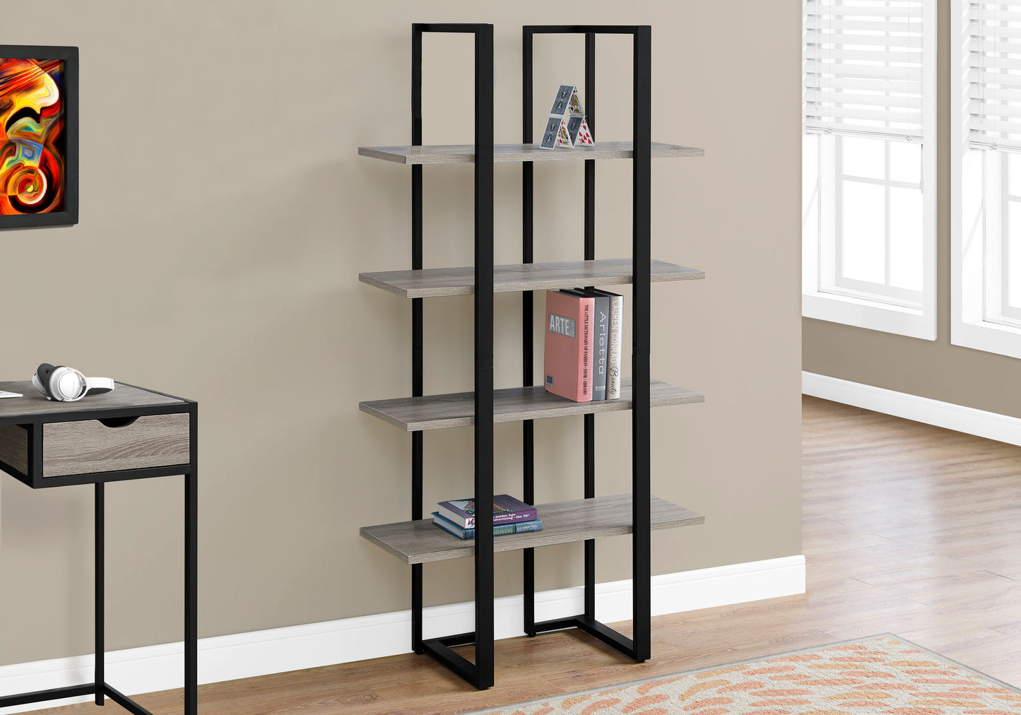 Modern grey wood and black metal ladder bookshelf with books
