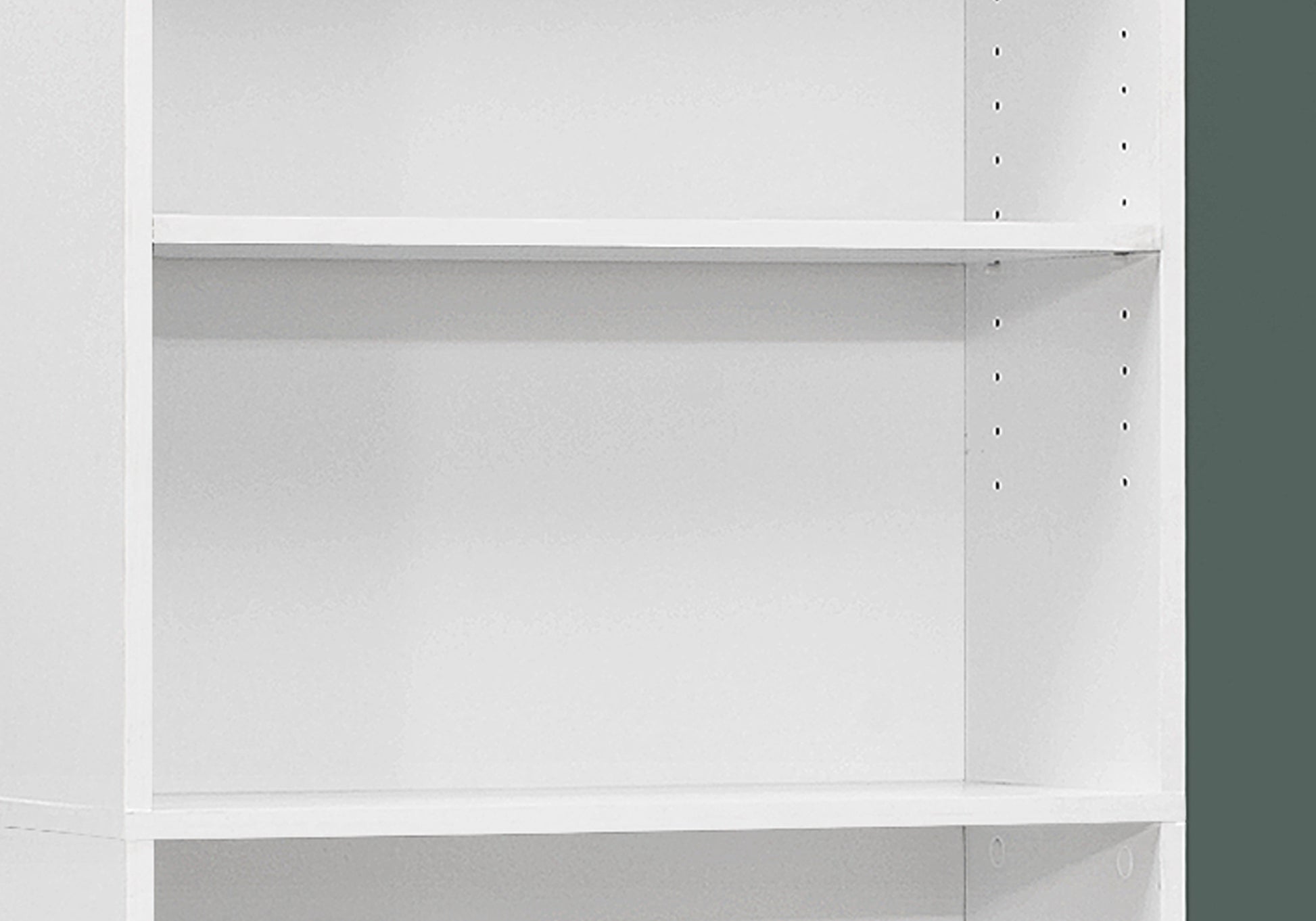 White particleboard bookshelf with adjustable shelf pegs