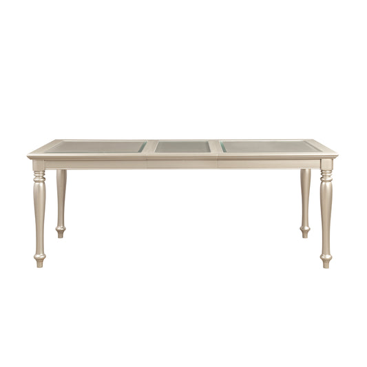 Elegant champagne dining table with glass inserts and turned legs
