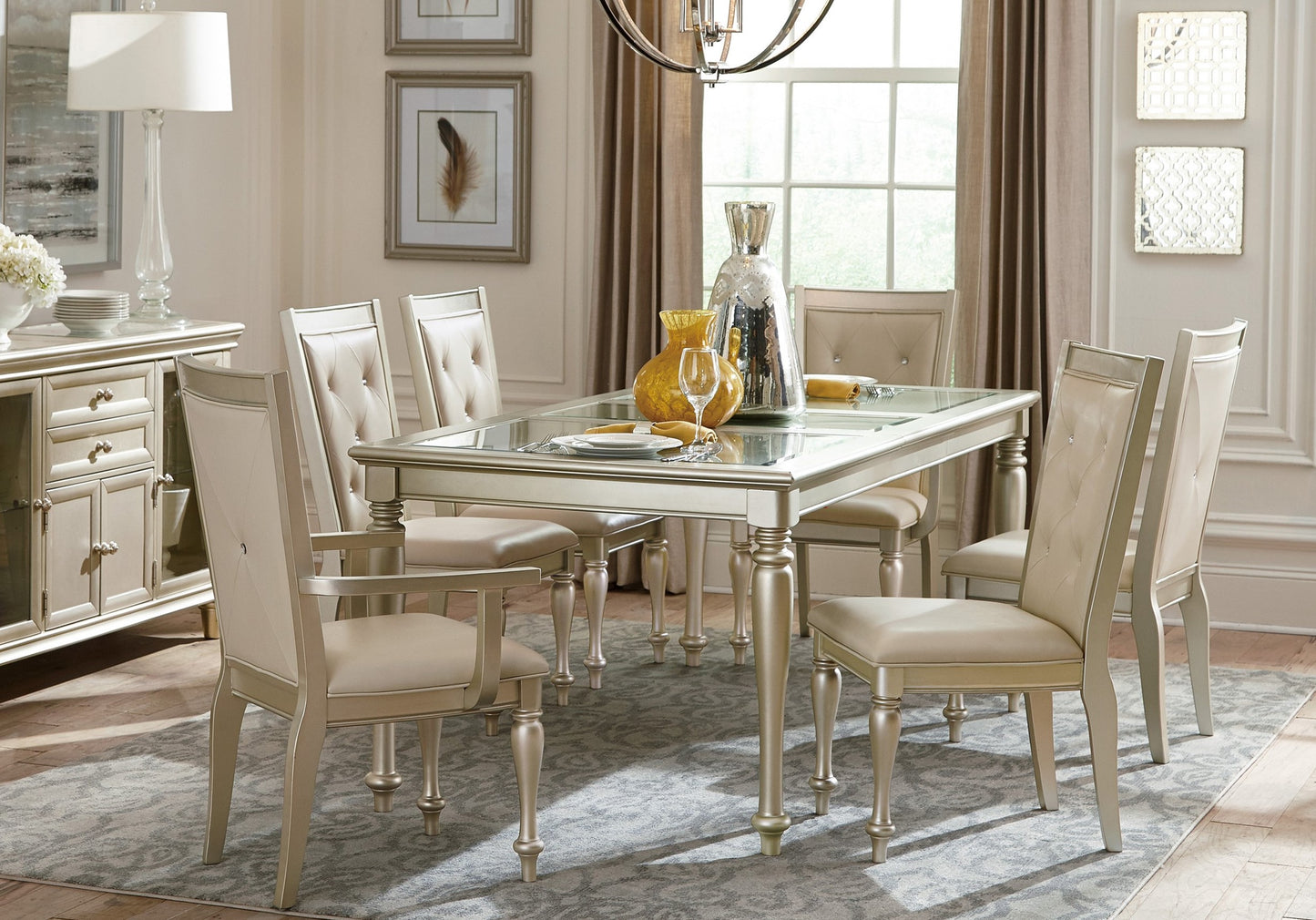 Silver dining table with glass top and upholstered chairs