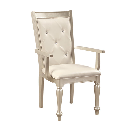 Elegant champagne upholstered arm chair with crystal tufting and decorative legs