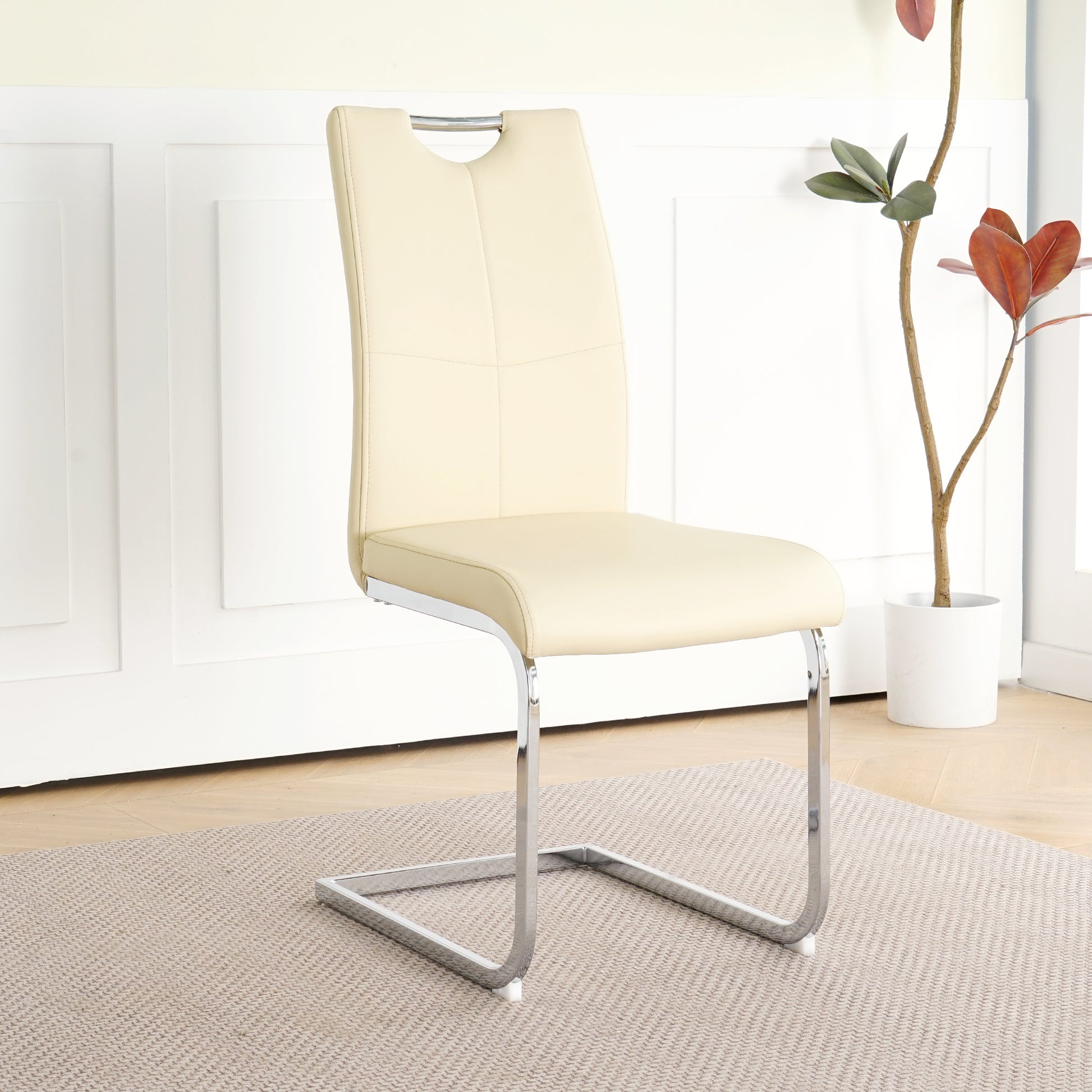 Cream faux leather dining chair with chrome cantilever base