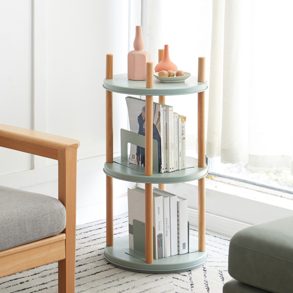 Mint green metal side table with wood accents and books