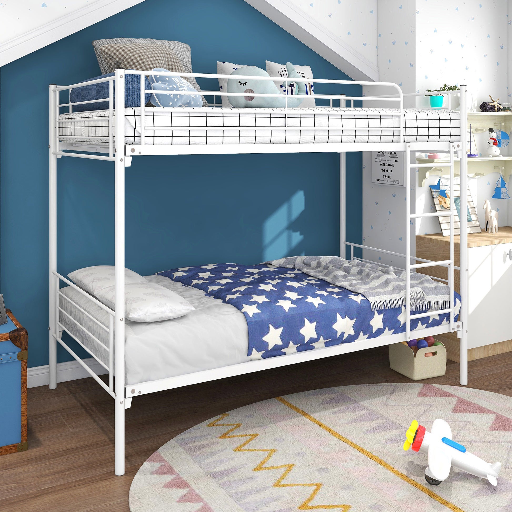 White metal bunk bed with blue star bedding